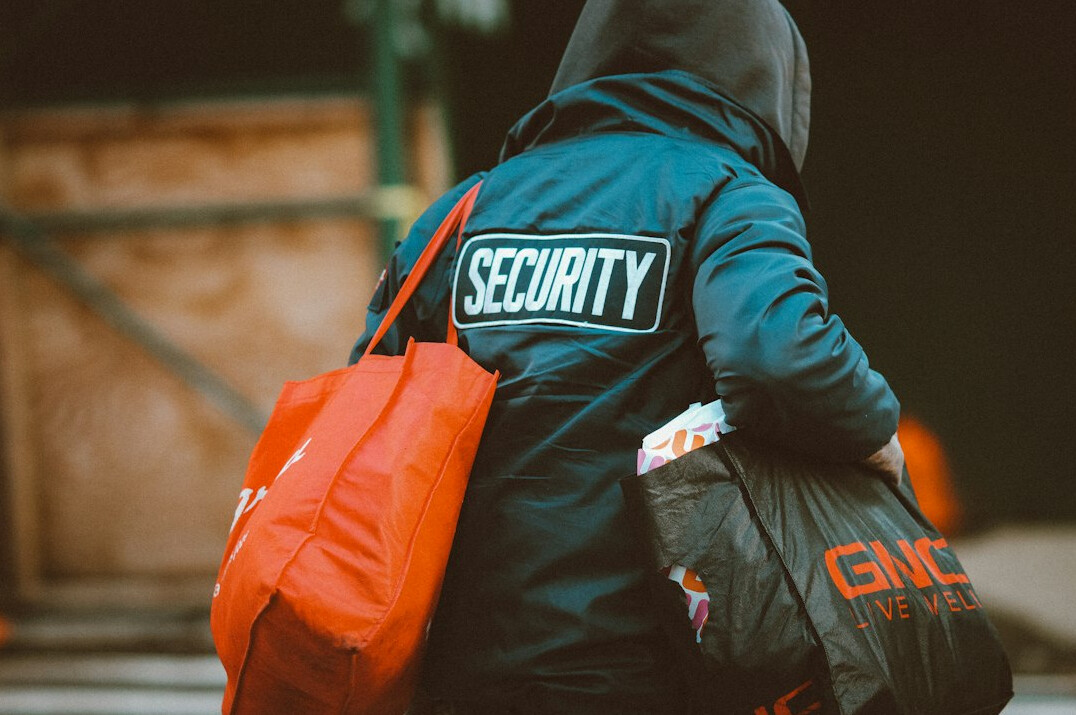 store detective monitoring shoppers