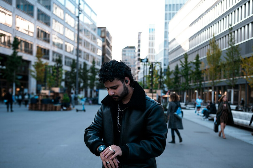 man checking watch nervously