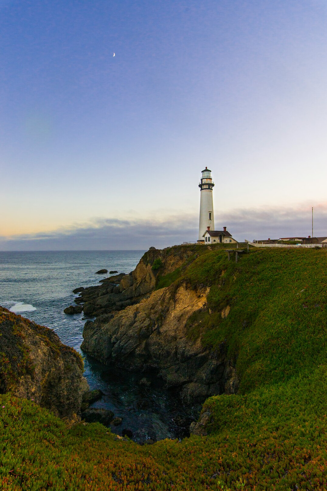 Old lighthouse on the coast at dusk