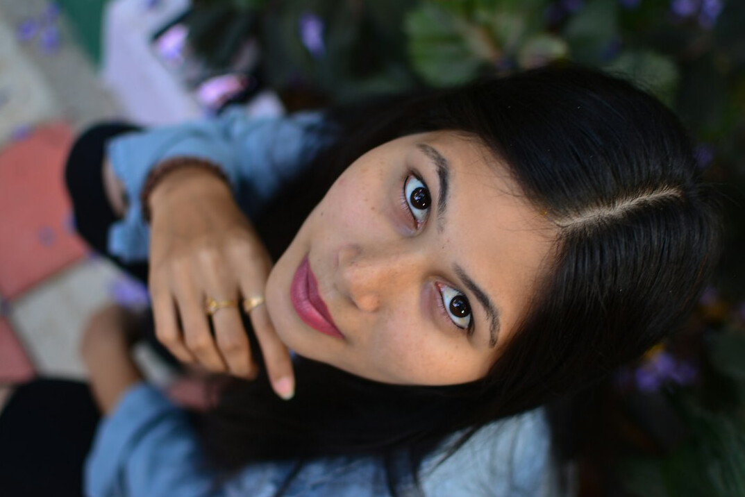 Studio portrait of a Uruguayan woman in her 40s, editor